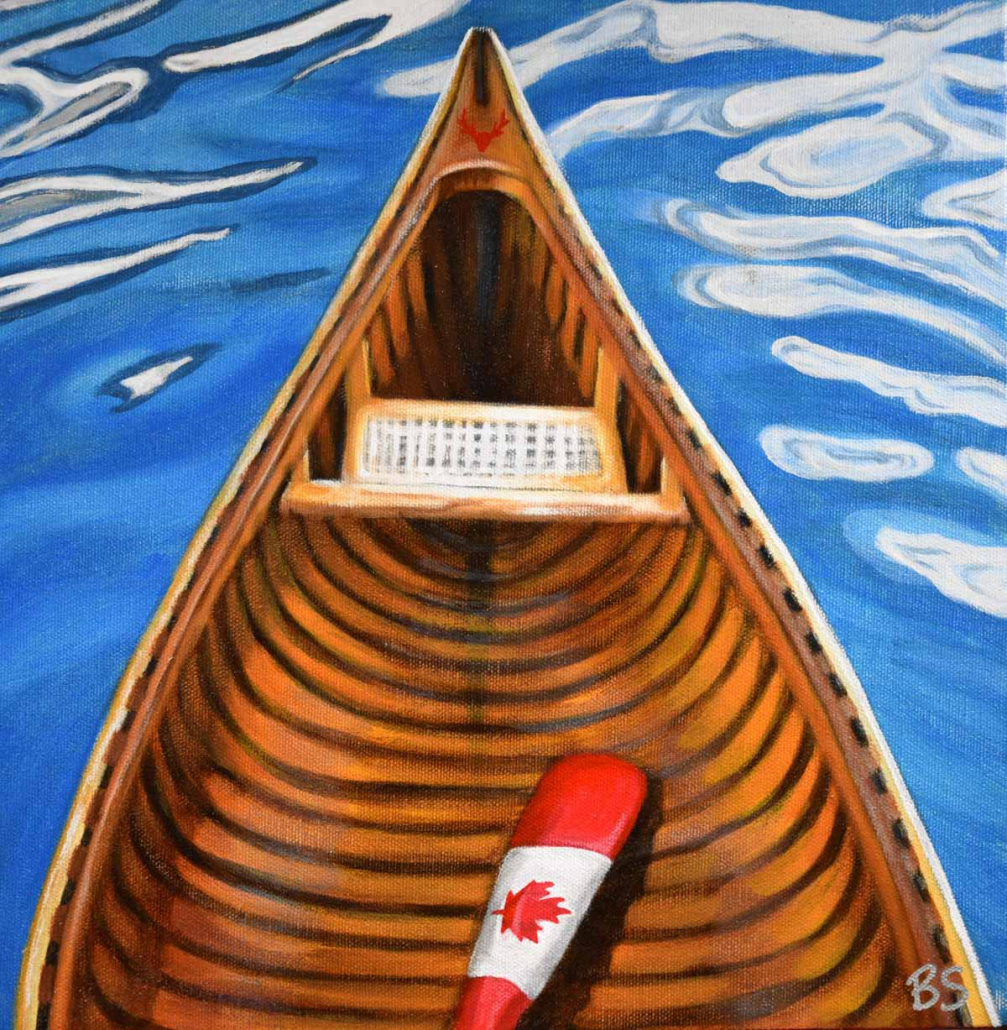 a canoe and a canada flag paddle