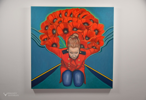 painting of woman with red poppies on a wall