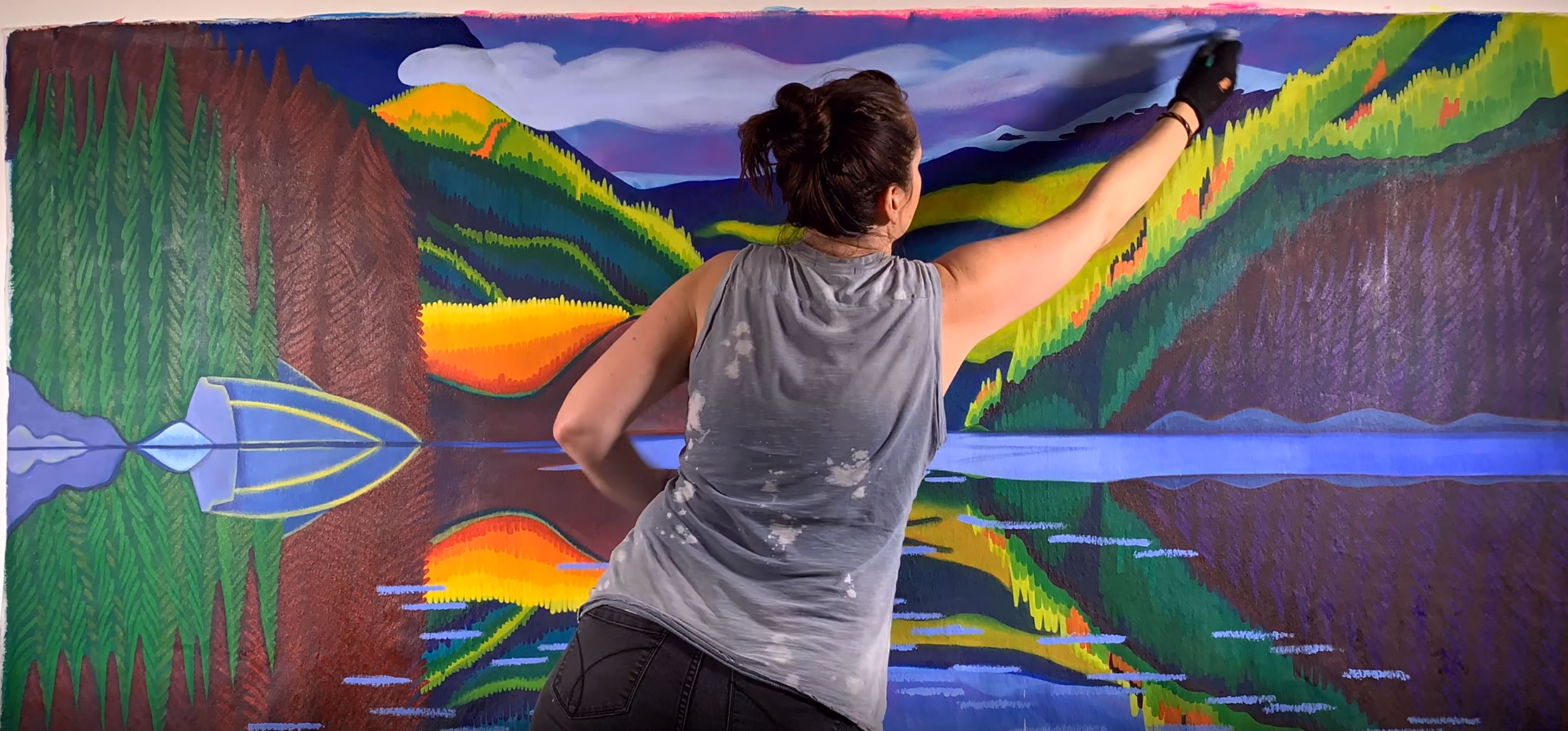 canadian artist brandy saturley makes a large landscape painting